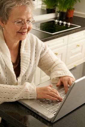 elder caregiver woman on laptop